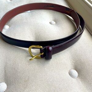 This is a brown leather belt with brass buckle. Coach label. size 36. Style 3921